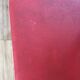 Set of 4 wooden chairs with red vinyl.