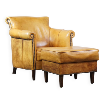 Cow leather armchair + ottoman finished with decorative nails