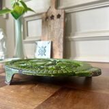 Old enameled cast iron trivet