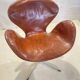 First edition Arne Jacobsen Swan chair, original patinated leather, 1950s