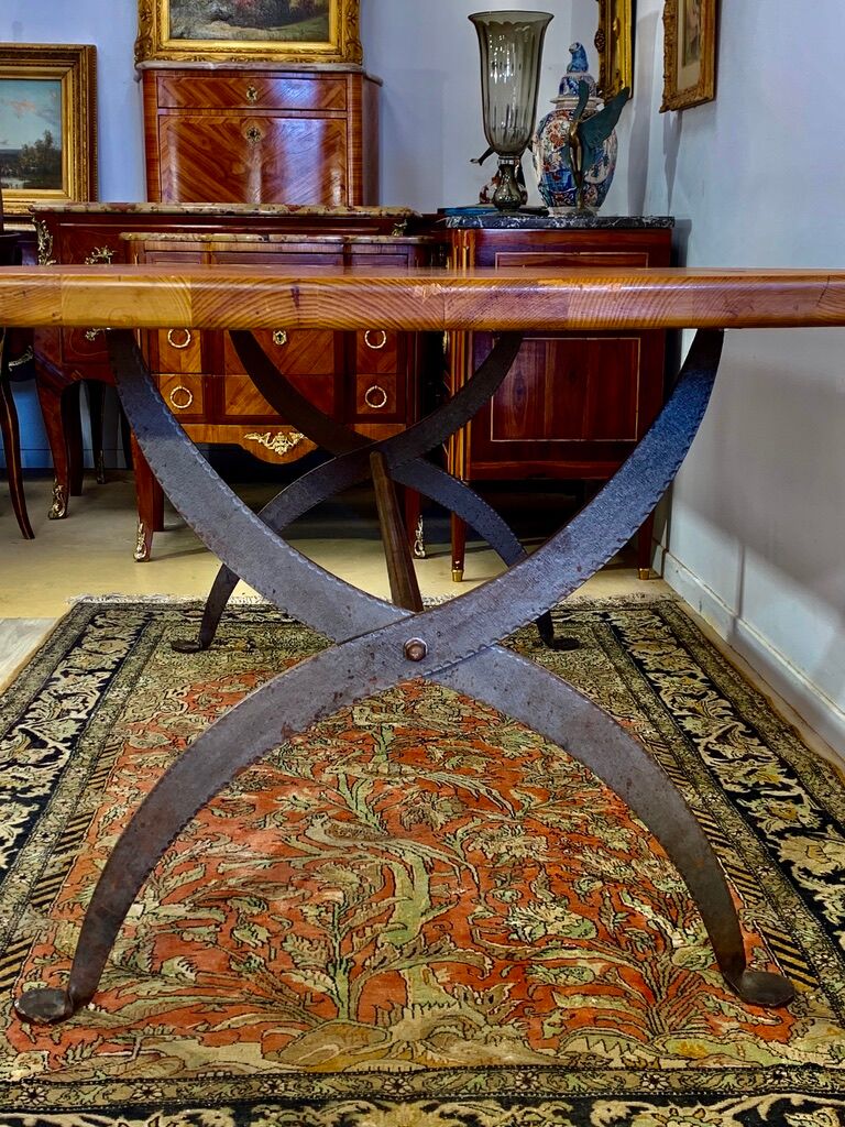 Rectangular wooden table, legs and spacer in hammered ironwork, 60s