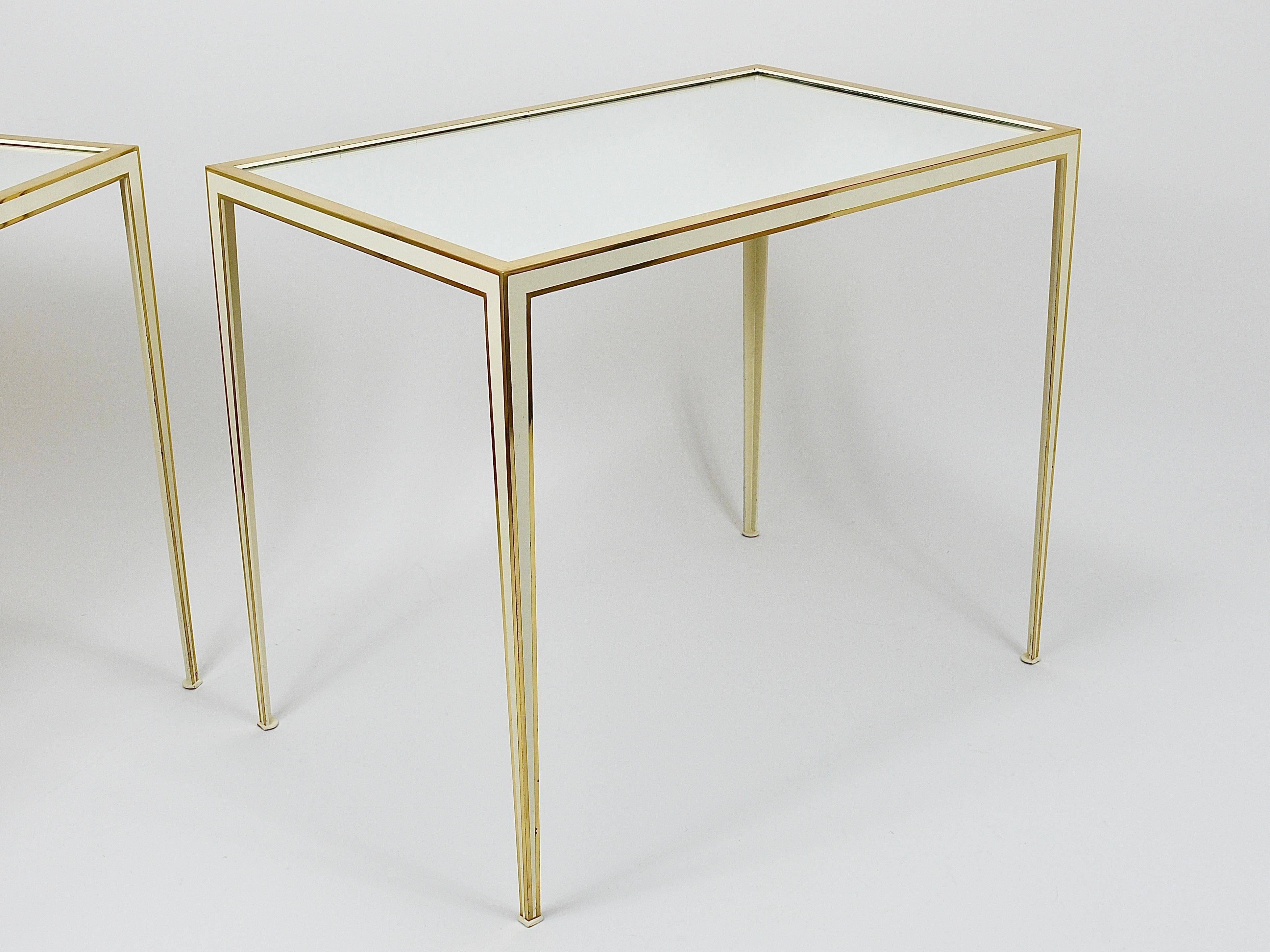 A pair of brass and white mirror tables from Vereinigte Werkstätten, Germany, 1970s.
