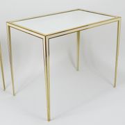 A pair of brass and white mirror tables from Vereinigte Werkstätten, Germany, 1970s.