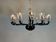Venetian chandelier in Murano glass in black and colourless, 12 light arms, circa 1990.
