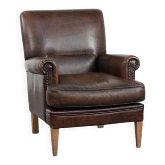 Characterful sheep leather armchair with a beautiful deep colour
