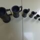 Set of 6 Fleur de Lys pewter measuring pots