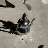 Silver-plated teapot with black handle