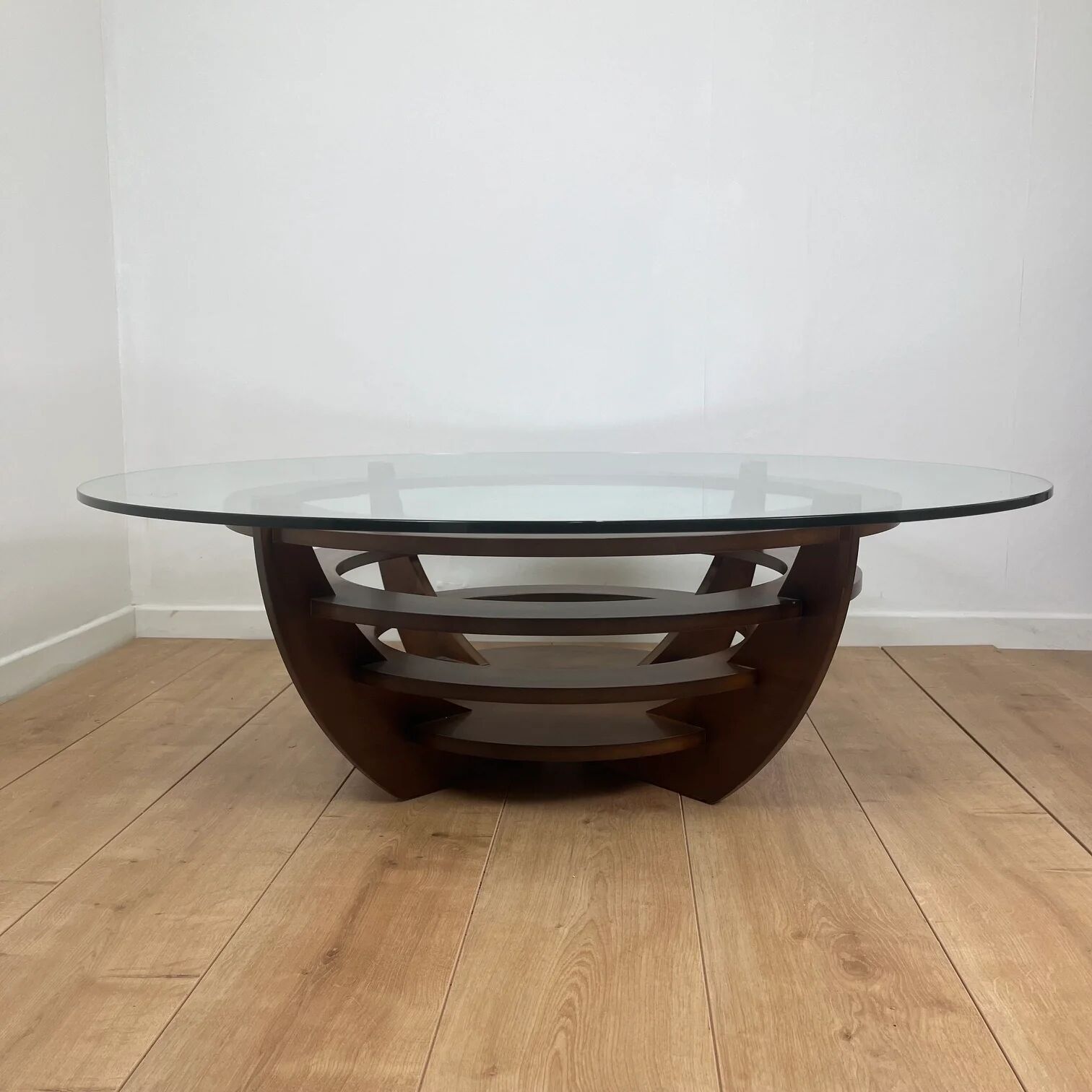 Sculptural coffee table with concentric rings, glass and wood, circa 1985.