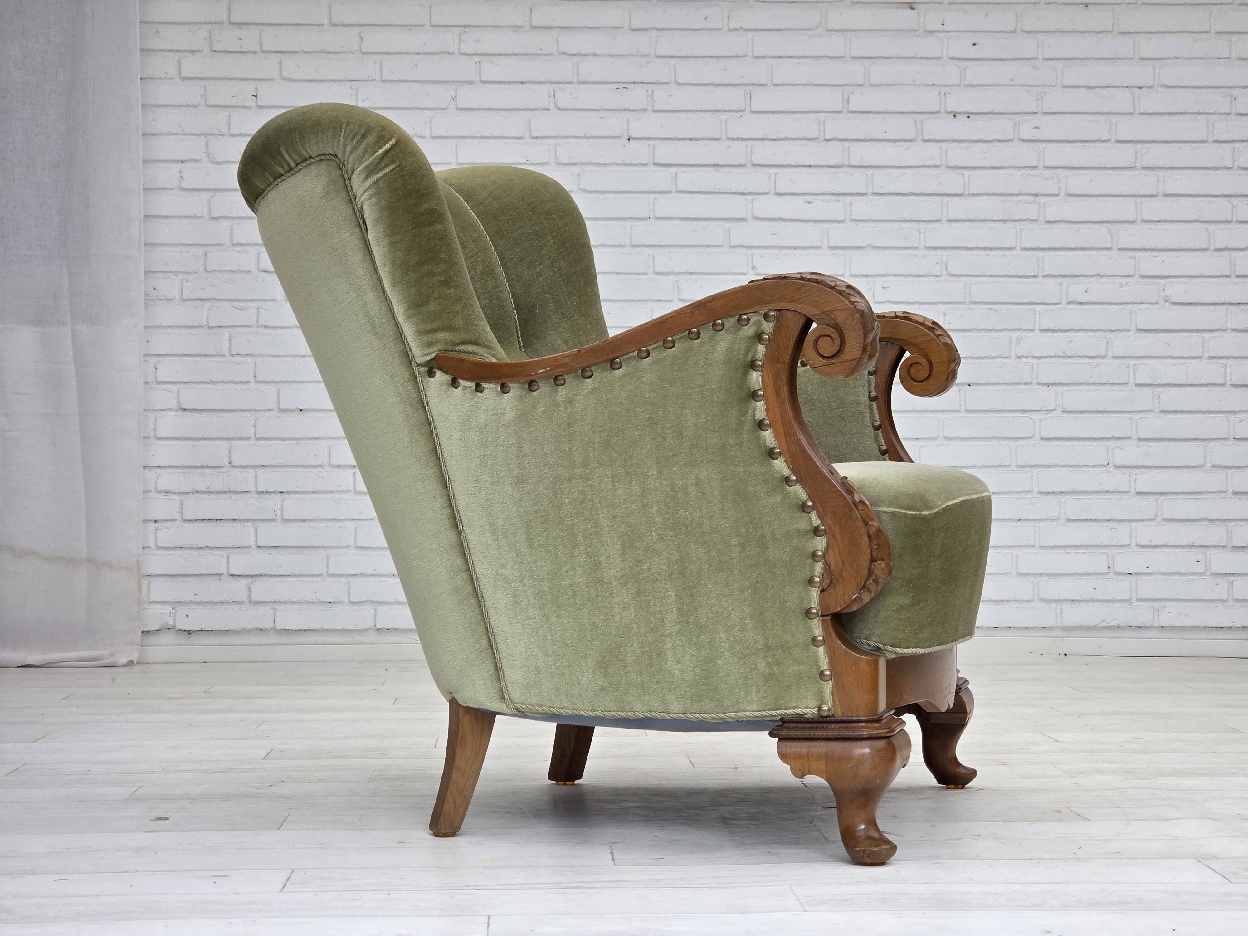 1960s, Danish armchair, green furniture velour, carved oak wood.
