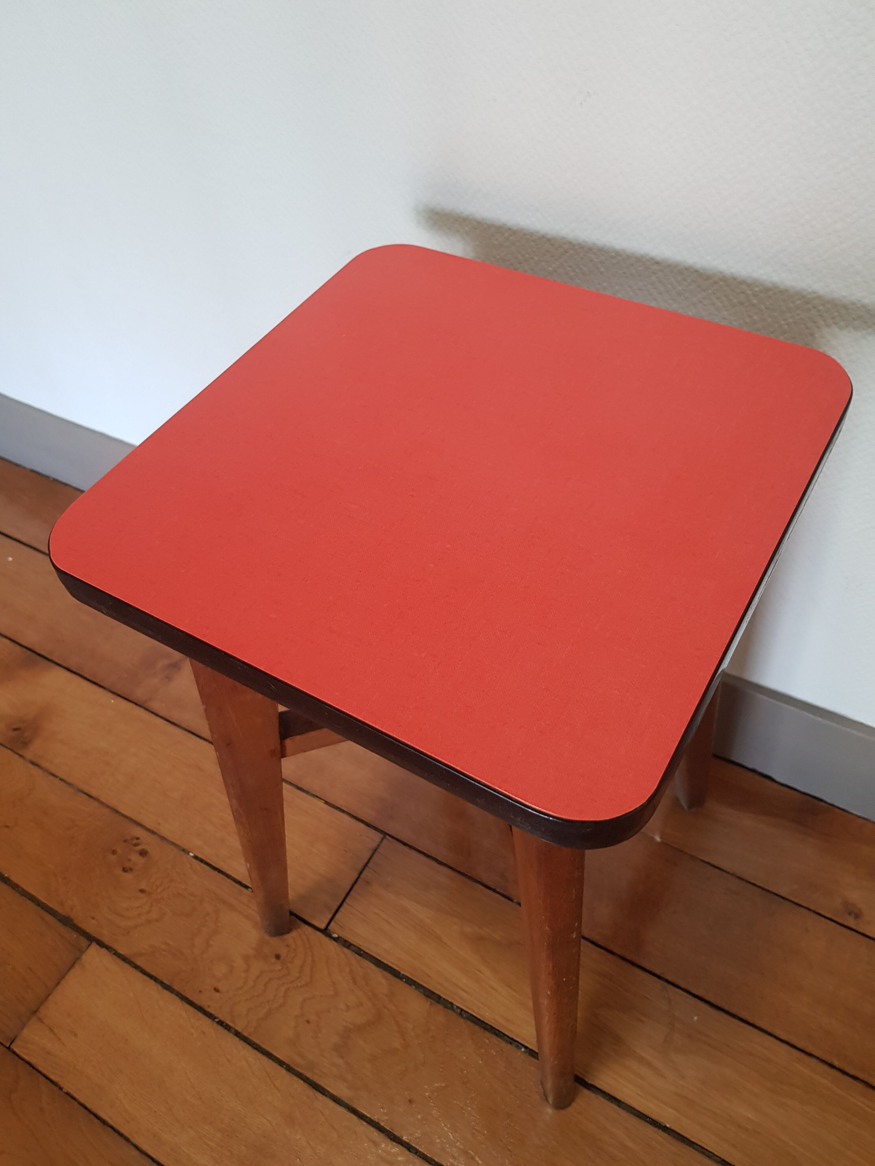 Wooden and red formica stool