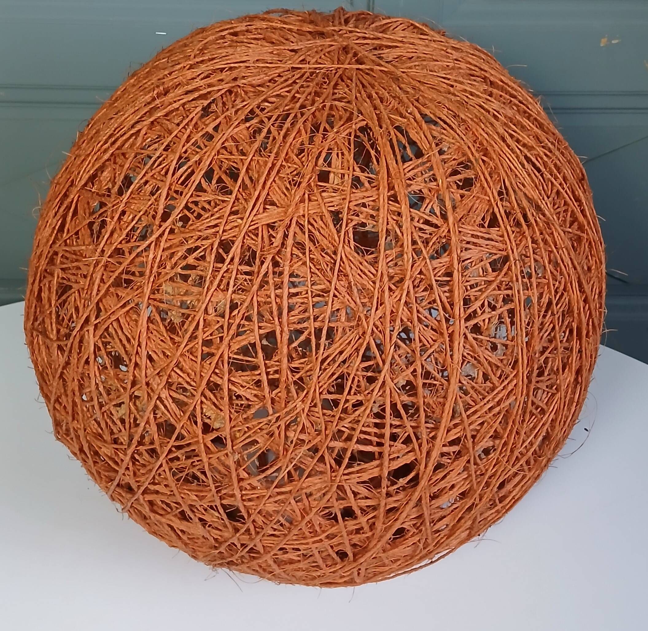 Orange lampshade in cord and rattan from the 1970s