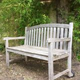 Vintage wooden garden bench with wheels
