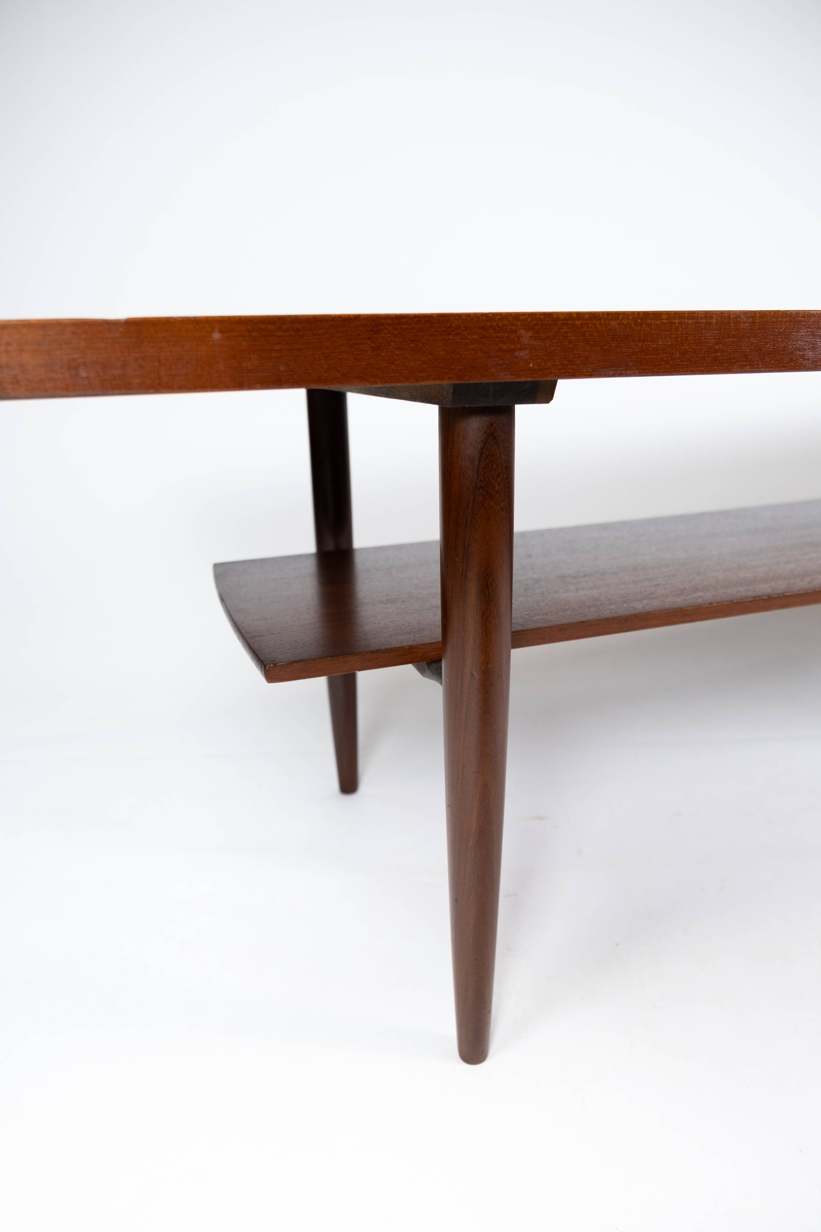 Coffee table in teak with blue tiles of danish design from the 1960s.