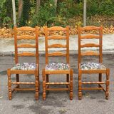 3 solid wood chairs with embroidered fabric
