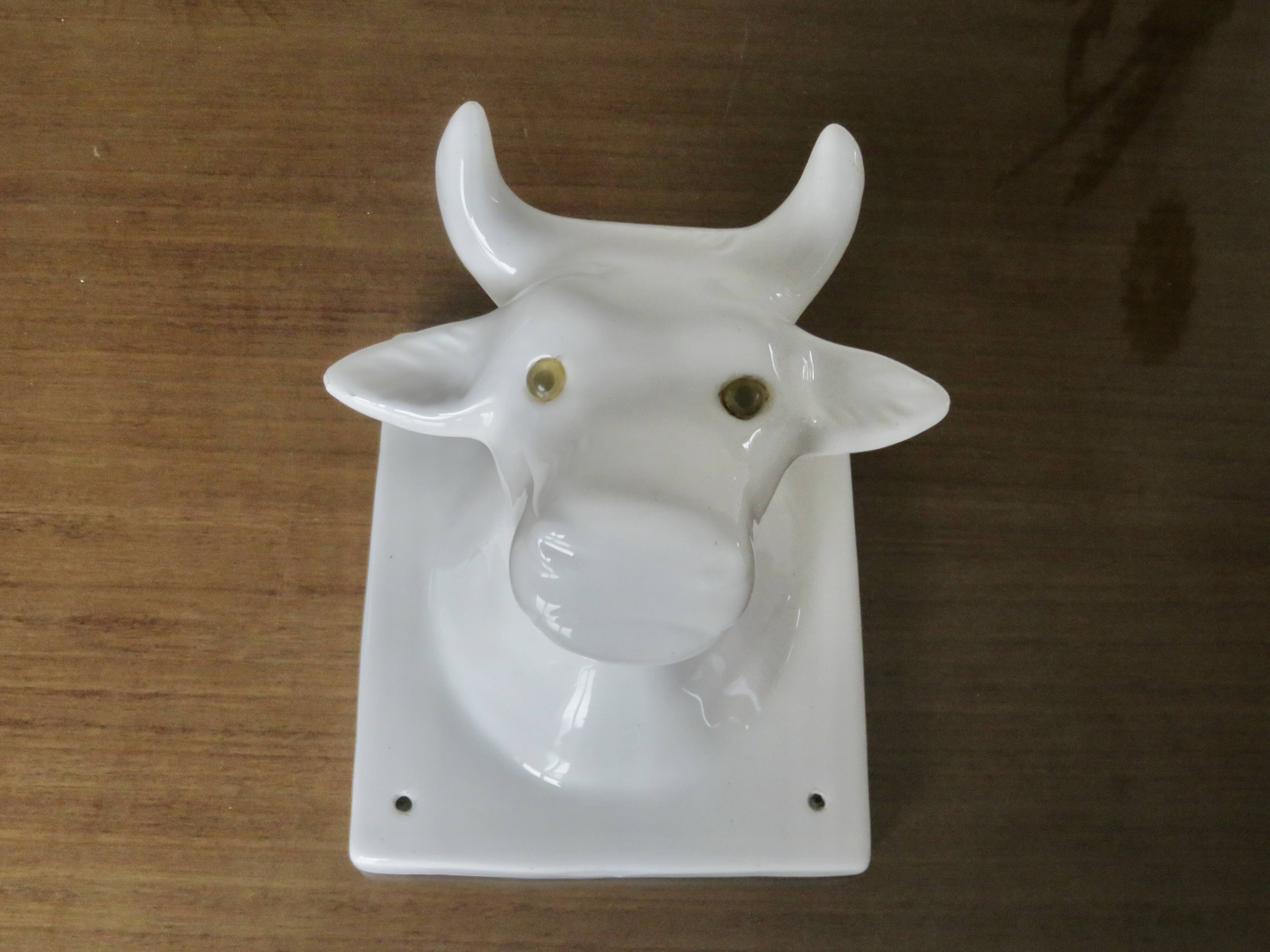 Stylized cow head in white ceramic, wall decoration from the 80s
