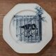 Set of three ironstone plates decorated with birds.