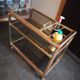 Brass and smoked glass bar trolley with casters