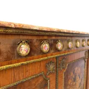 An antique French Louis XVI-style marble-top side cabinet