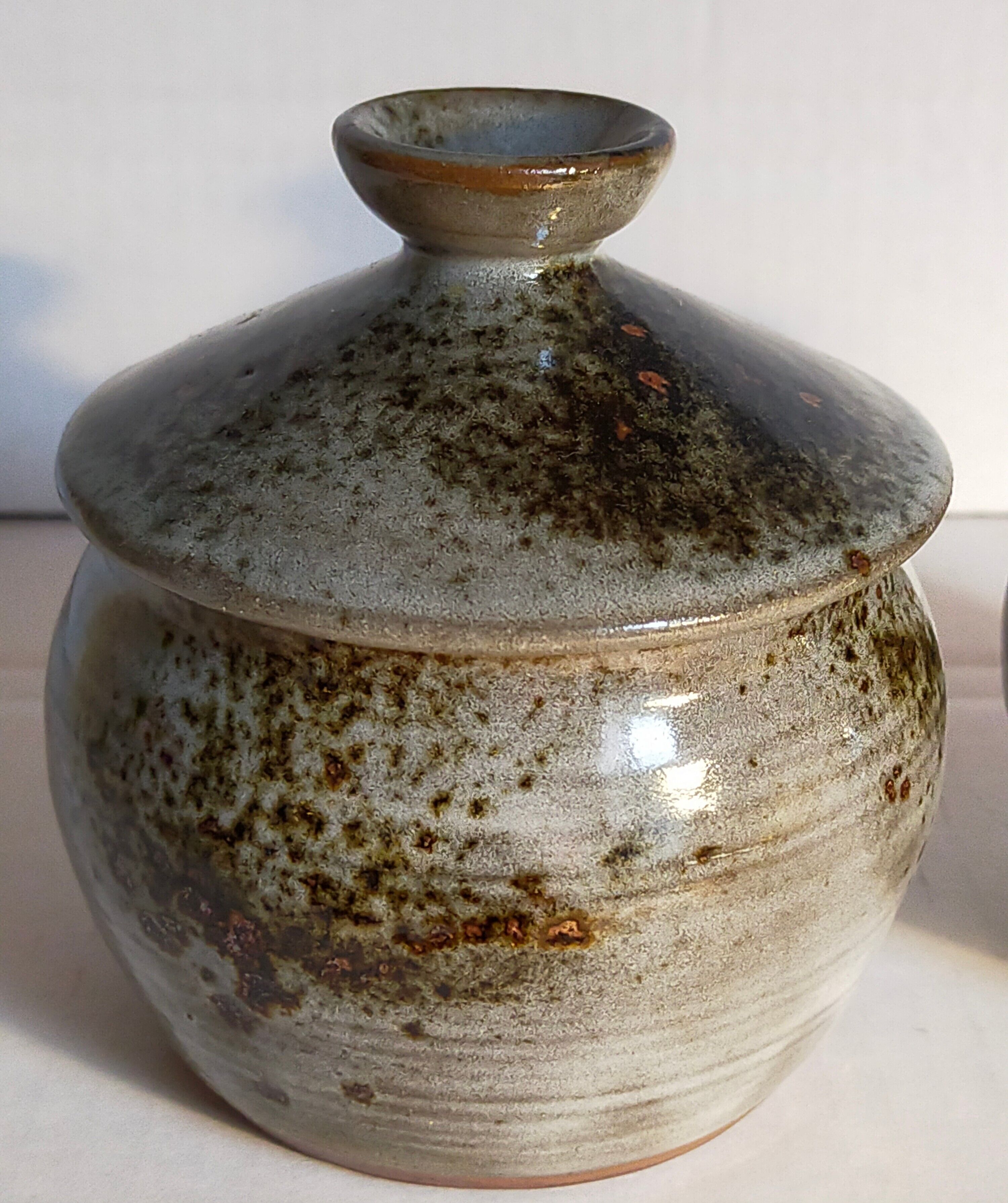 Duo of potter's pots covered in vintage glazed stoneware