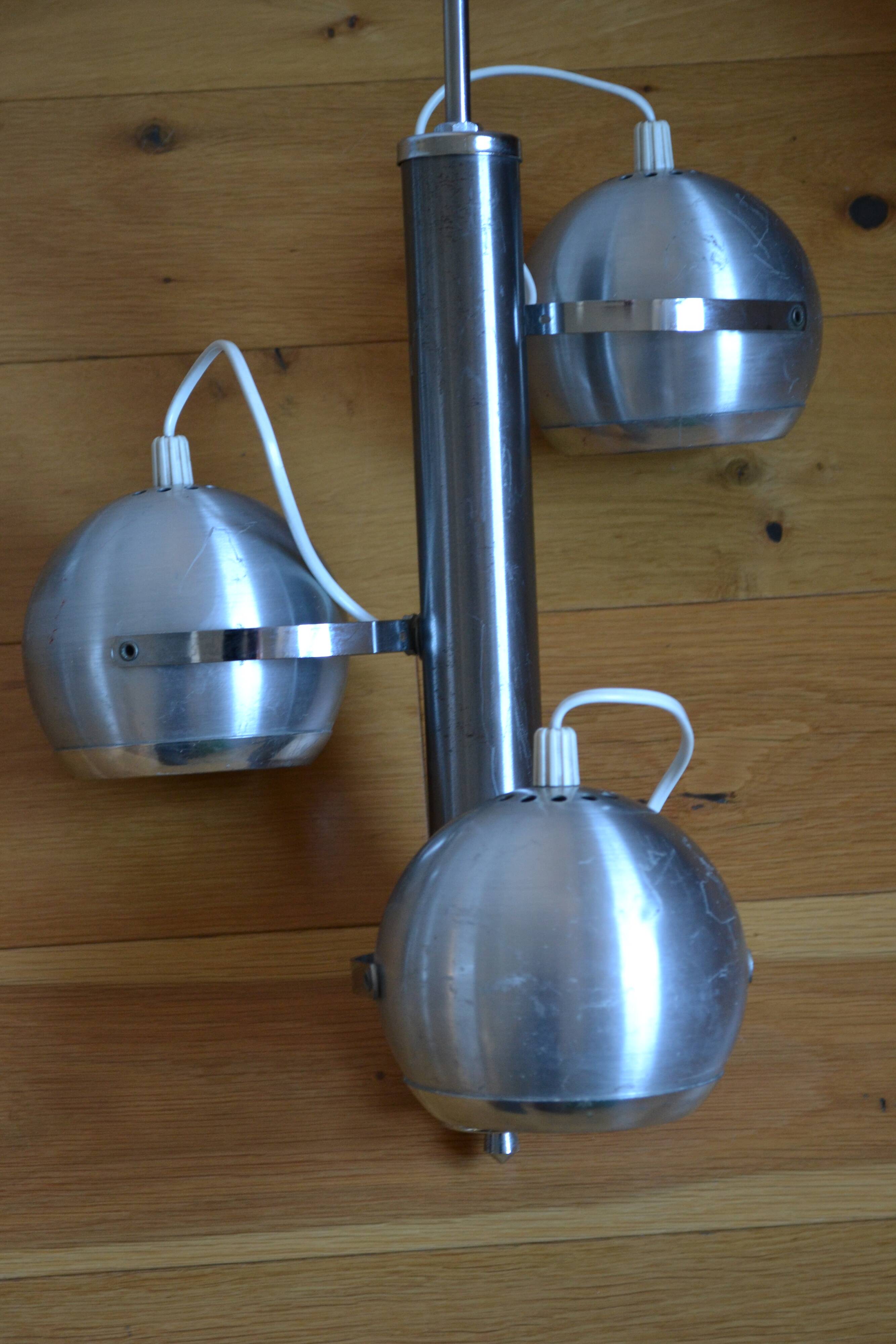 Pair of 70s space age eye ball chandeliers in brushed aluminum