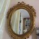 Antique oval mirror with gold leaf – Pediment with bow & floral motifs style