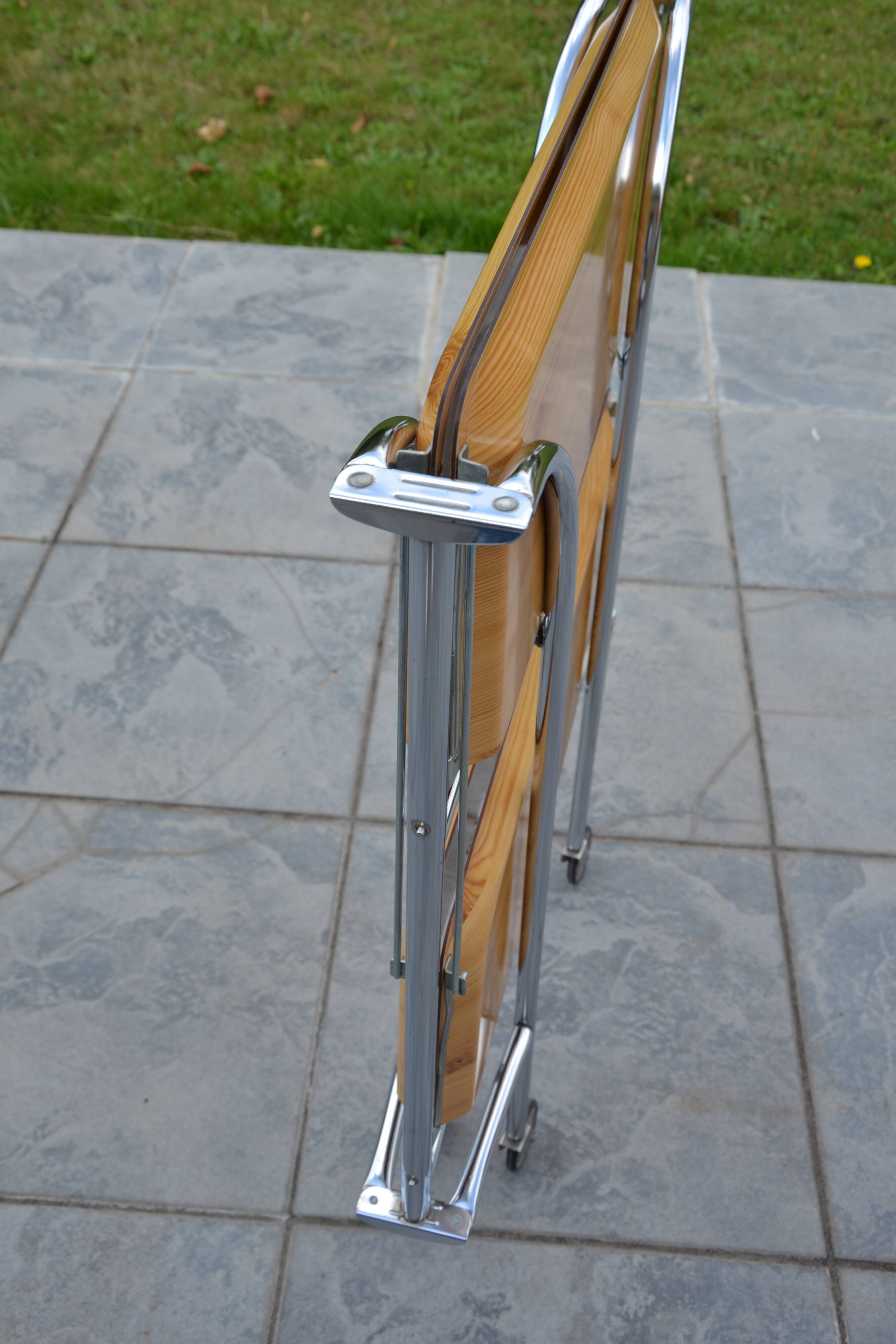 Folding dessert trolley on chrome metal wheels and formica.