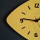 Formica vintage asymmetrical silent wall clock "Yellow Star"