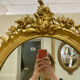 Miroir oval en bois doré 70x49cm