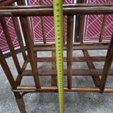 Old small bed or cradle for baby in vintage rattan