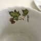 Tea cup, solitary service, naturalistic decoration, in Limoges porcelain.