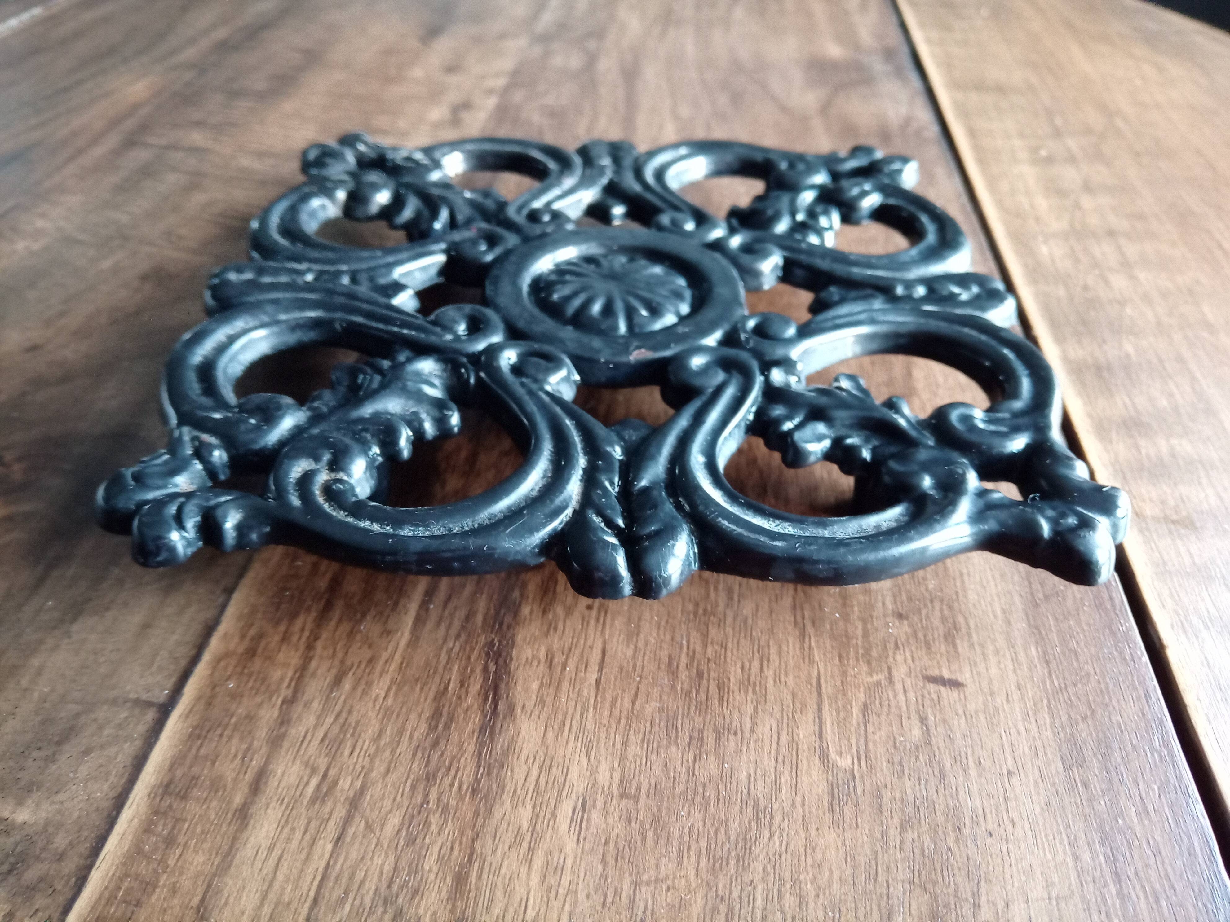 Old dish bottoms in black cast iron