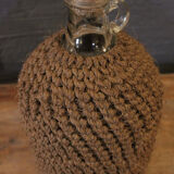 Cylinder glass surrounded by rope