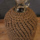 Cylinder glass surrounded by rope