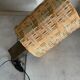 Small modernist table lamp with hand-woven shade.