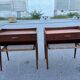 Modernist Danish teak bedside tables with rattan shelves, set of 2