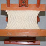 Antique Chinese folding chair with carvings, circa 1900-1920.