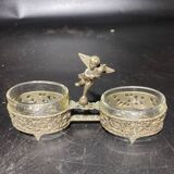 Spice centerpiece and serving spoon topped with a brass cherub