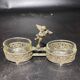 Spice centerpiece and serving spoon topped with a brass cherub