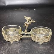 Spice centerpiece and serving spoon topped with a brass cherub
