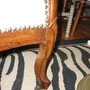Armchair and its footrest