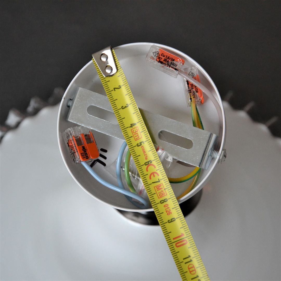 Articulated opaline pleated wall light