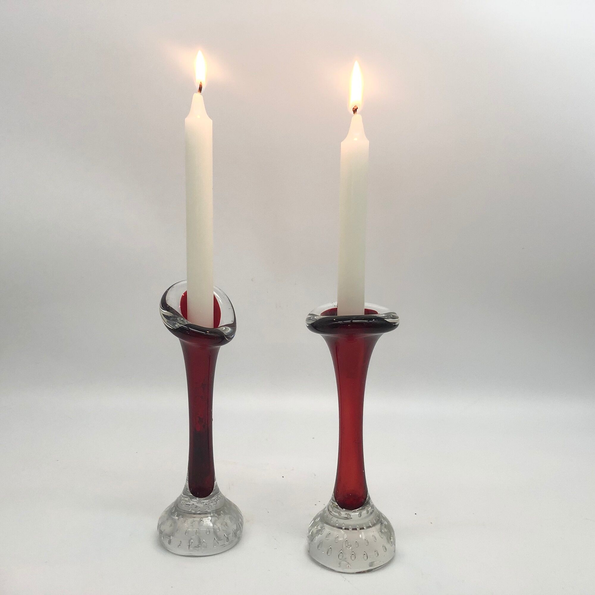 Duo of glass candle holders in the style of Murano