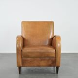 Luxury armchair made of cowhide leather with a beautiful warm colour scheme