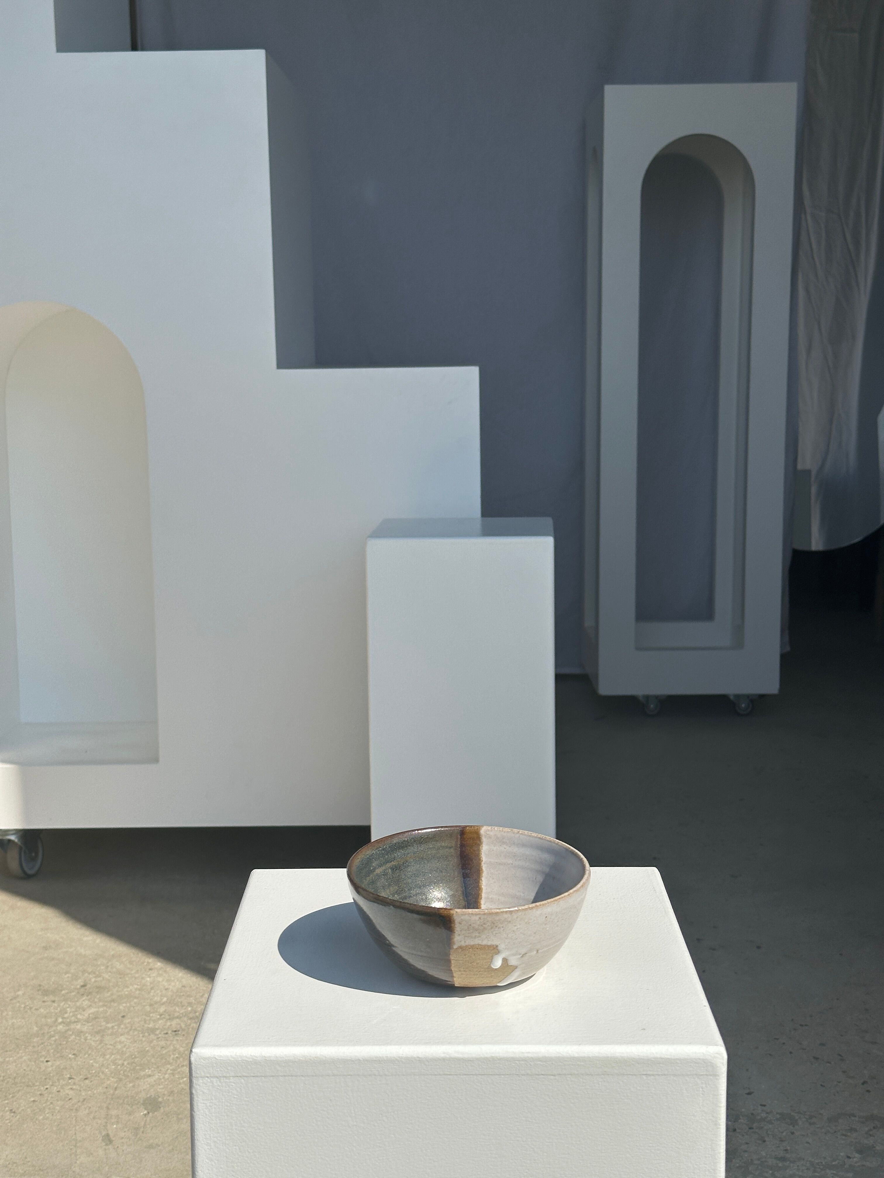 White and glossy brown two-tone ceramic bowl, matt earth