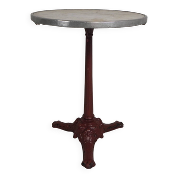 Bistro table with cast iron legs and marble top, 1920s.