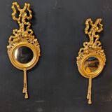 Pair of round Louis XVI style giltwood mirrors