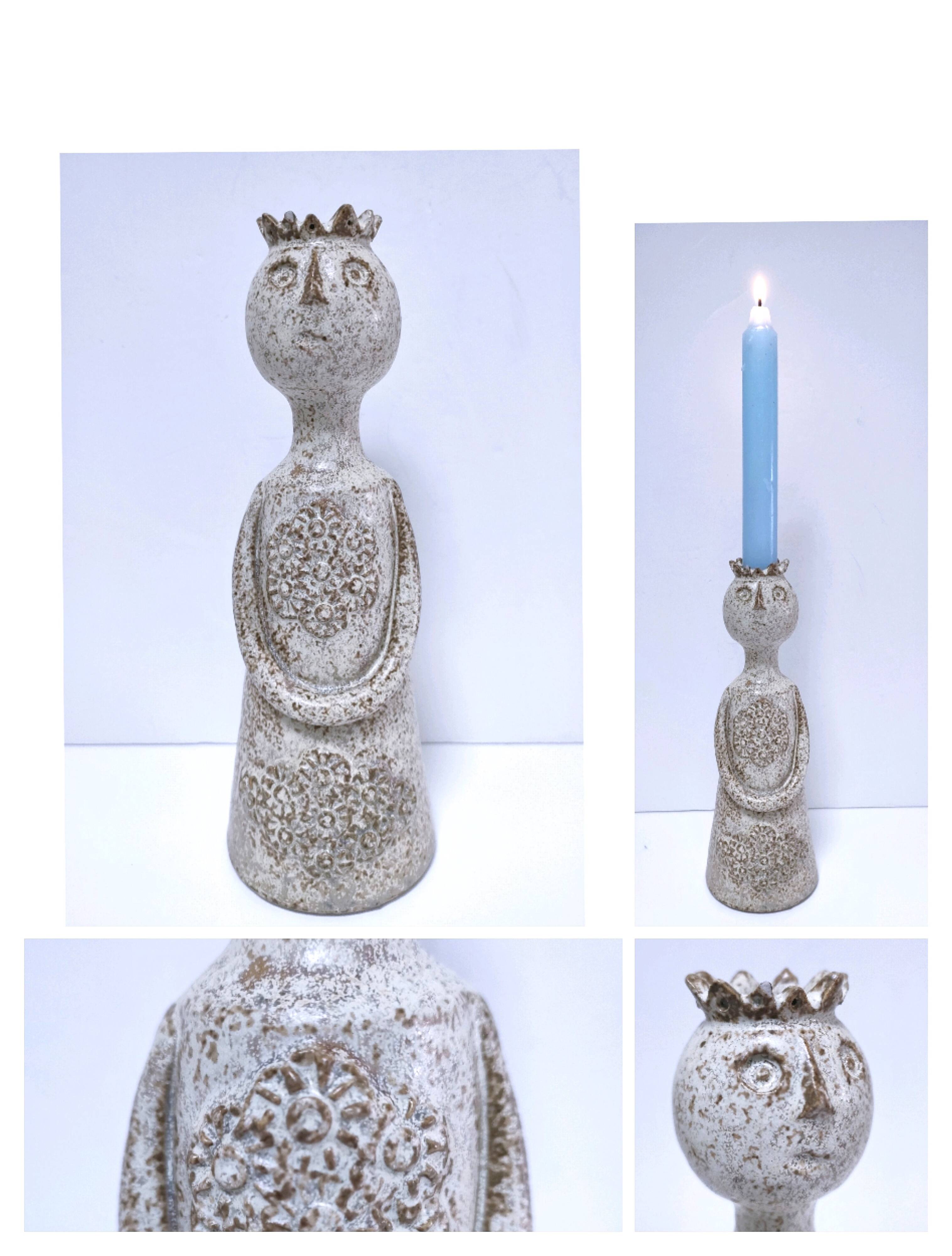 ceramic candle holder with crowned head signed P