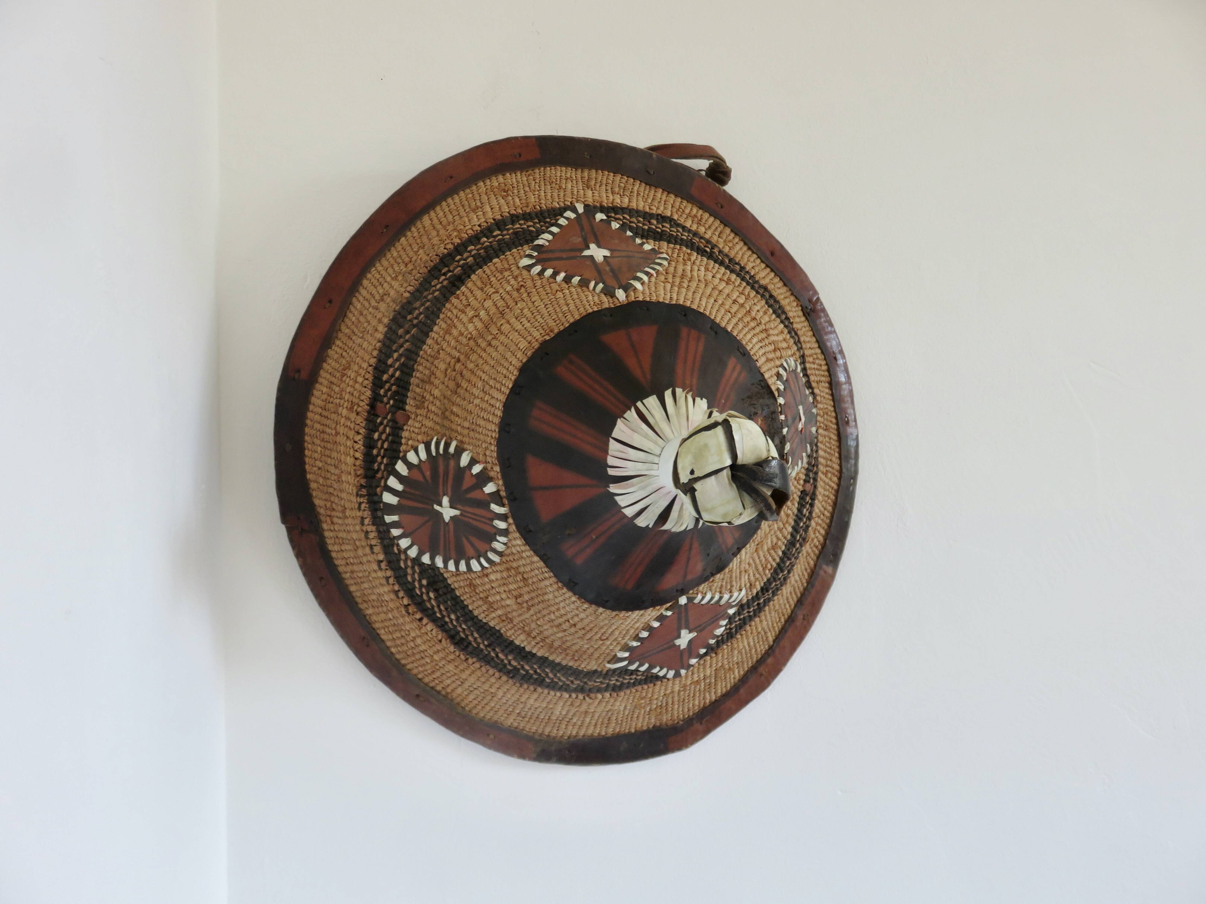 African conical hat, Fulani, in leather and braided rope, 1900, wall decoration