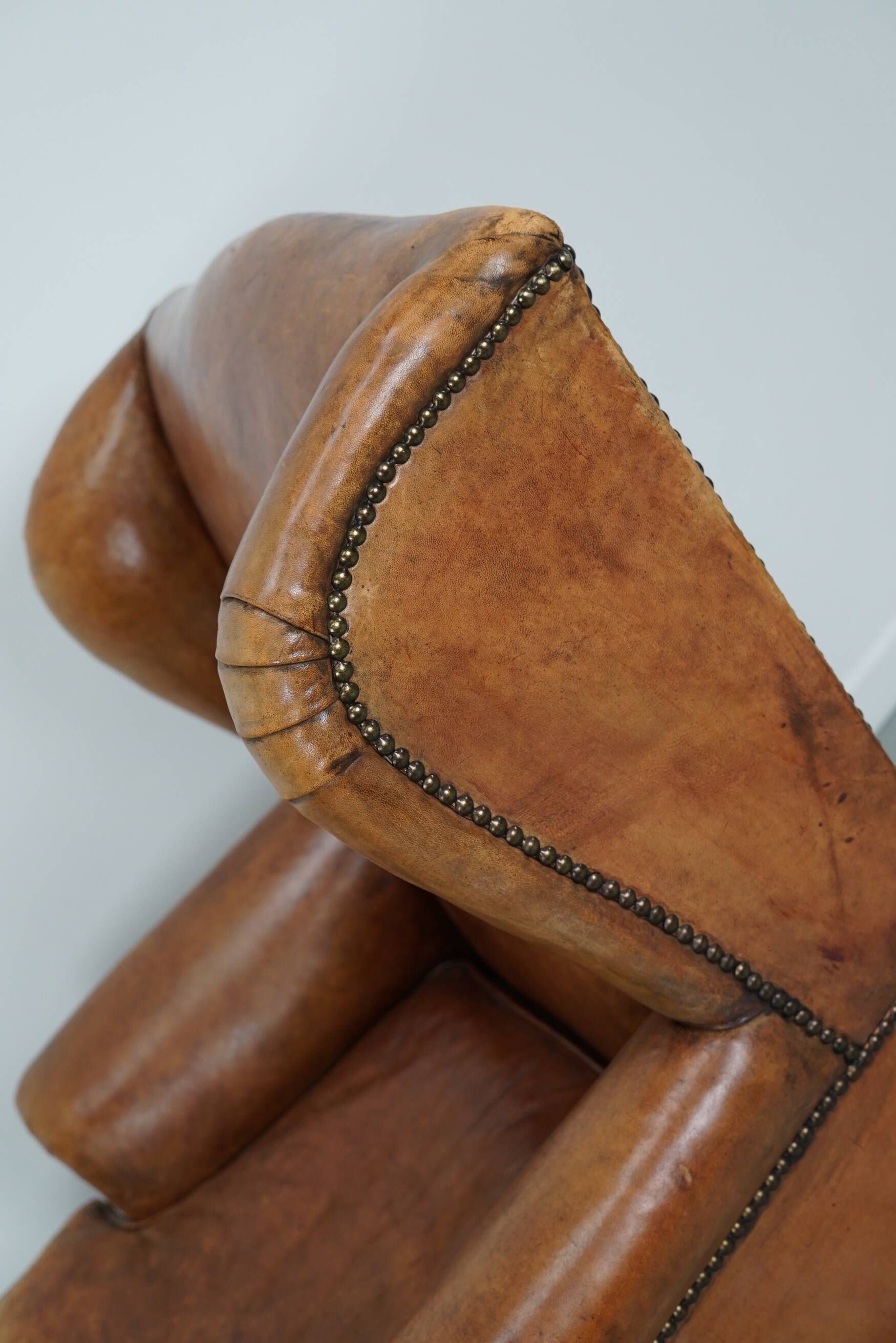 Vintage Dutch cognac coloured leather club chair, with footstool