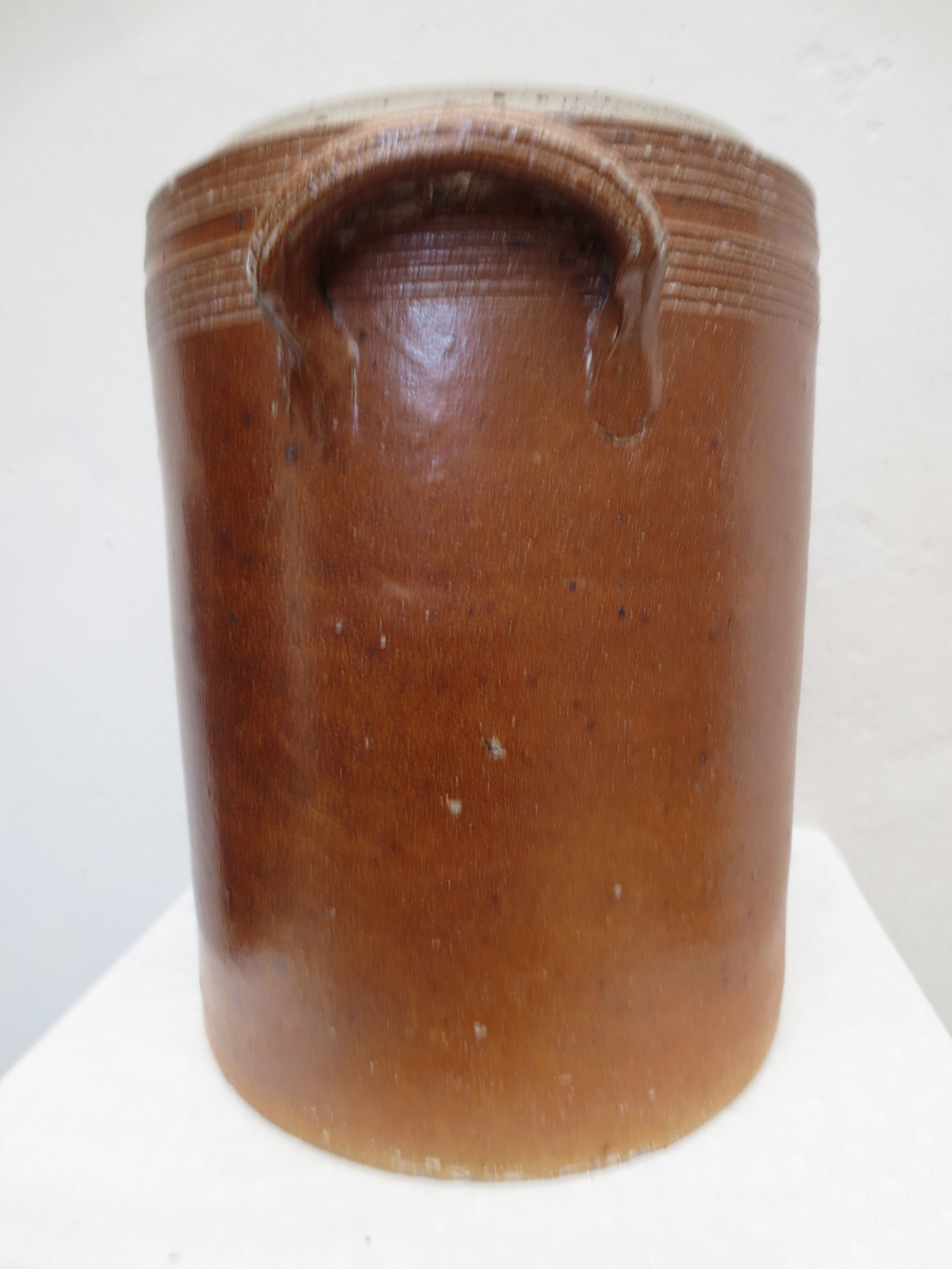 Old butter jug in flaming sandies